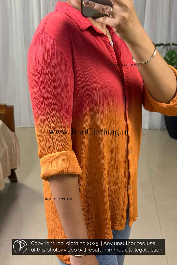Person wearing a red to orange gradient shirt with 'Roo Clothing' branding.