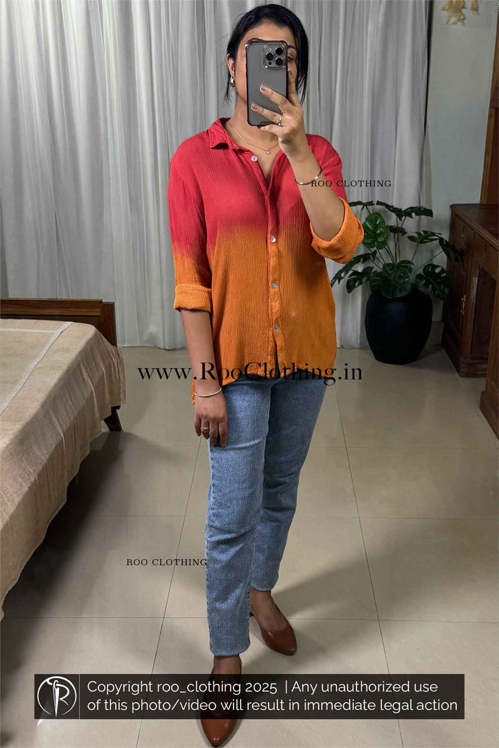 Person wearing a two-tone shirt and jeans indoors with 'Roo Clothing' branding.